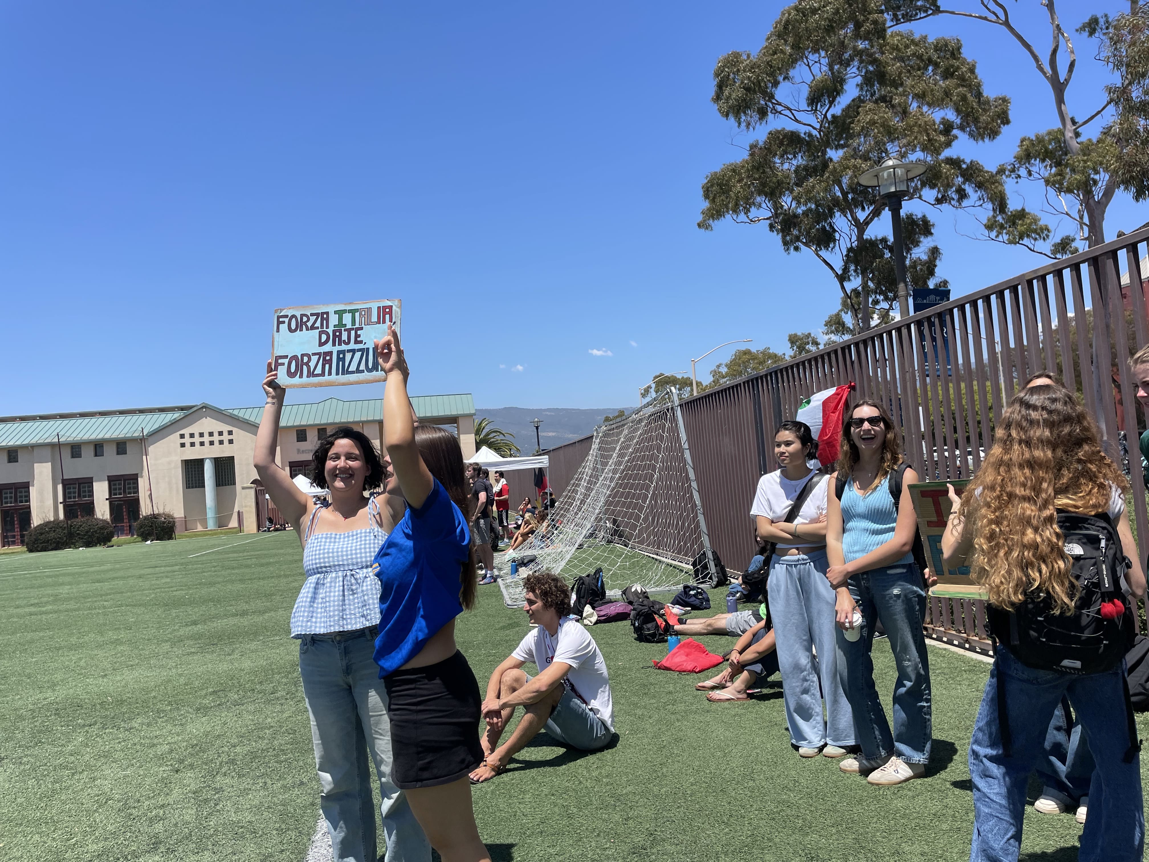 Supporters holding up signs