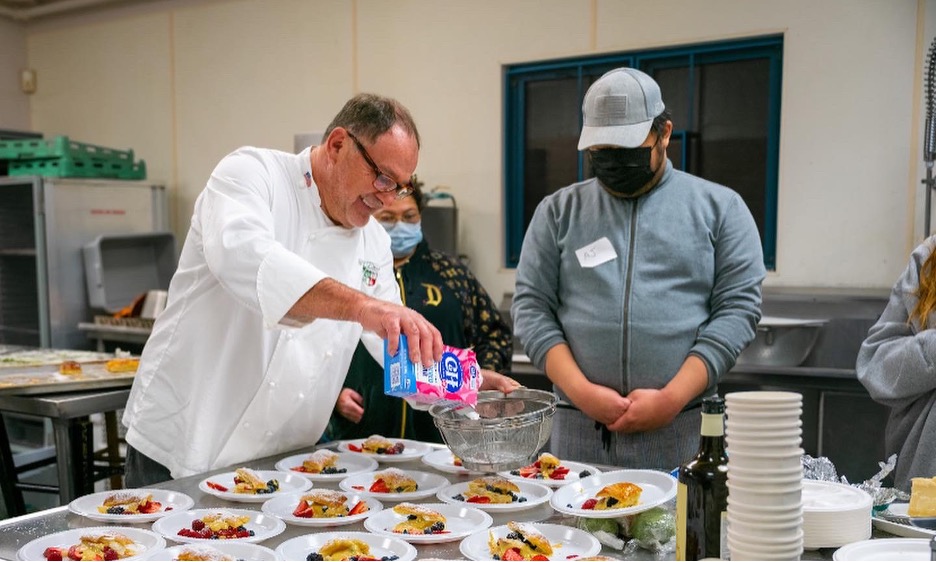 Italian Club chef preparing dishes for the event